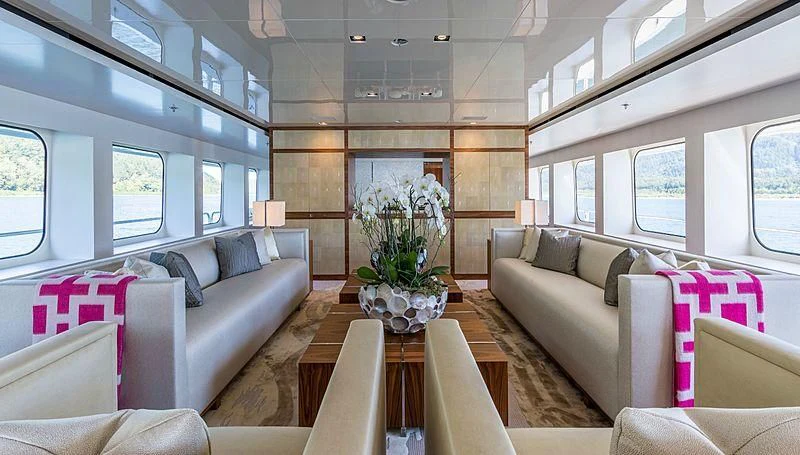 a living room with a flower pot aboard CHASSEUR Yacht for Charter