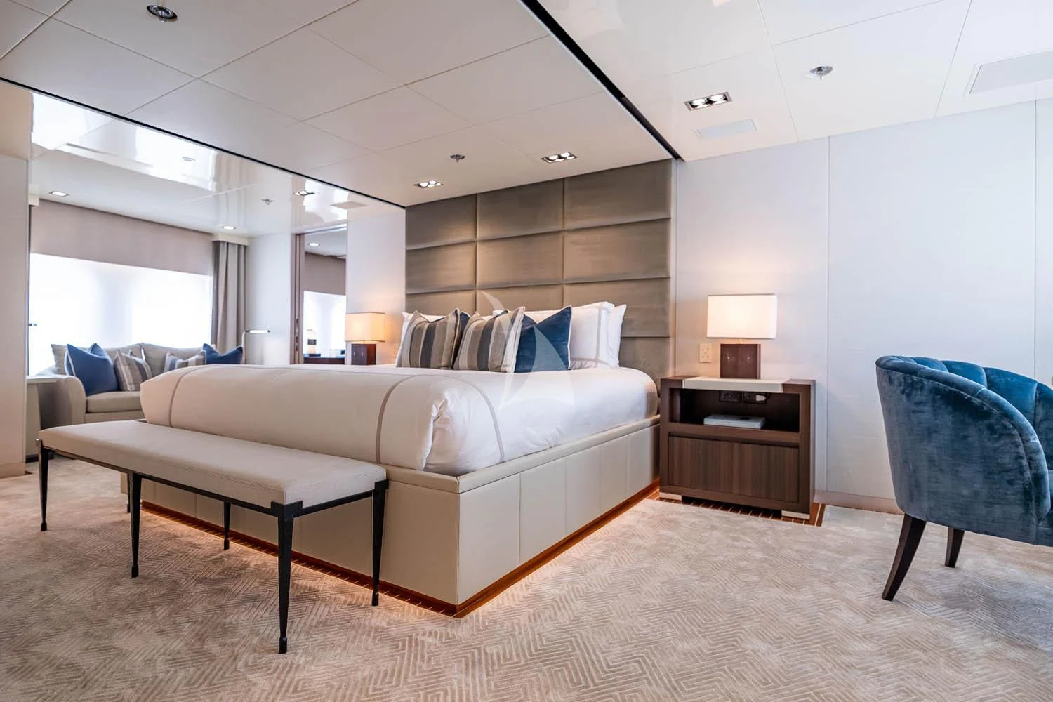 a large living room with a white couch and a table aboard CHASSEUR Yacht for Charter