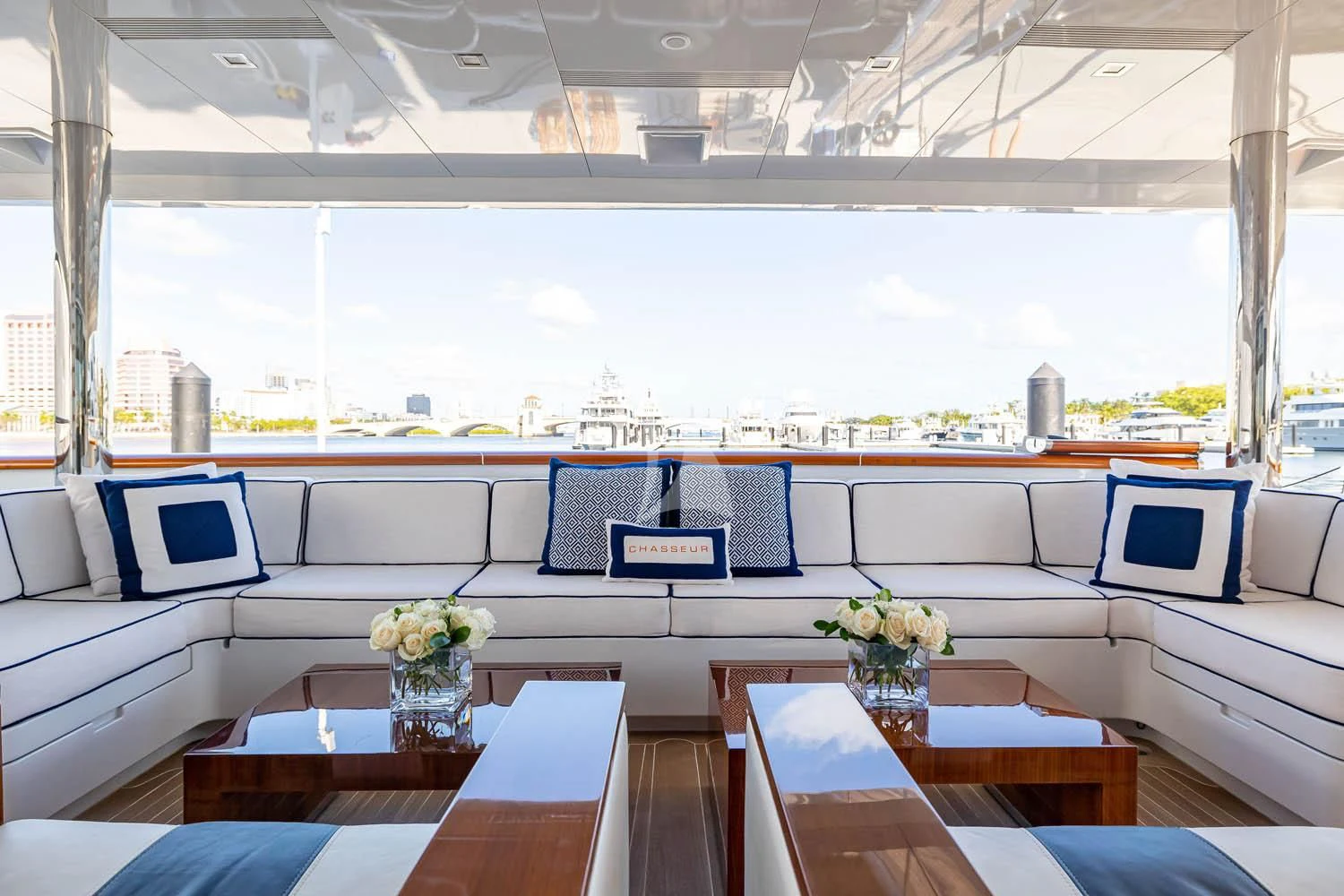 a room with a table and chairs aboard CHASSEUR Yacht for Charter