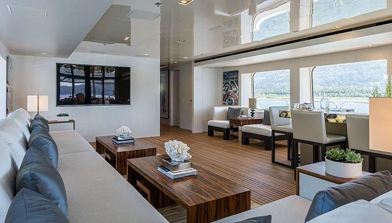 a living room with a large window aboard CHASSEUR Yacht for Charter
