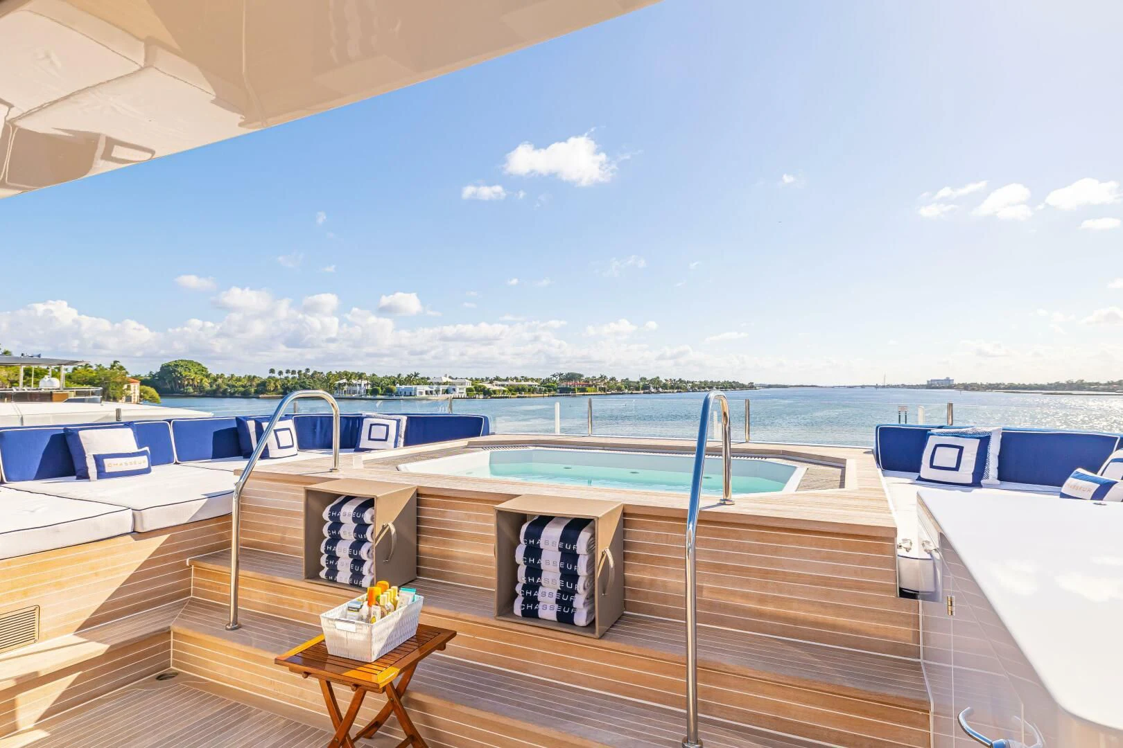 a deck with a view of the water and boats aboard CHASSEUR Yacht for Charter