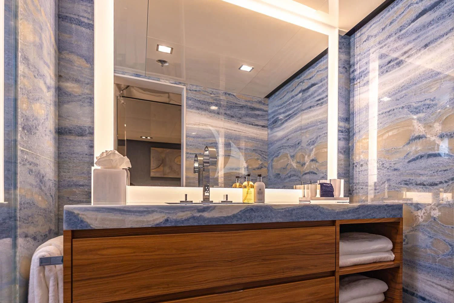 a bathroom with a large mirror aboard CHASSEUR Yacht for Charter