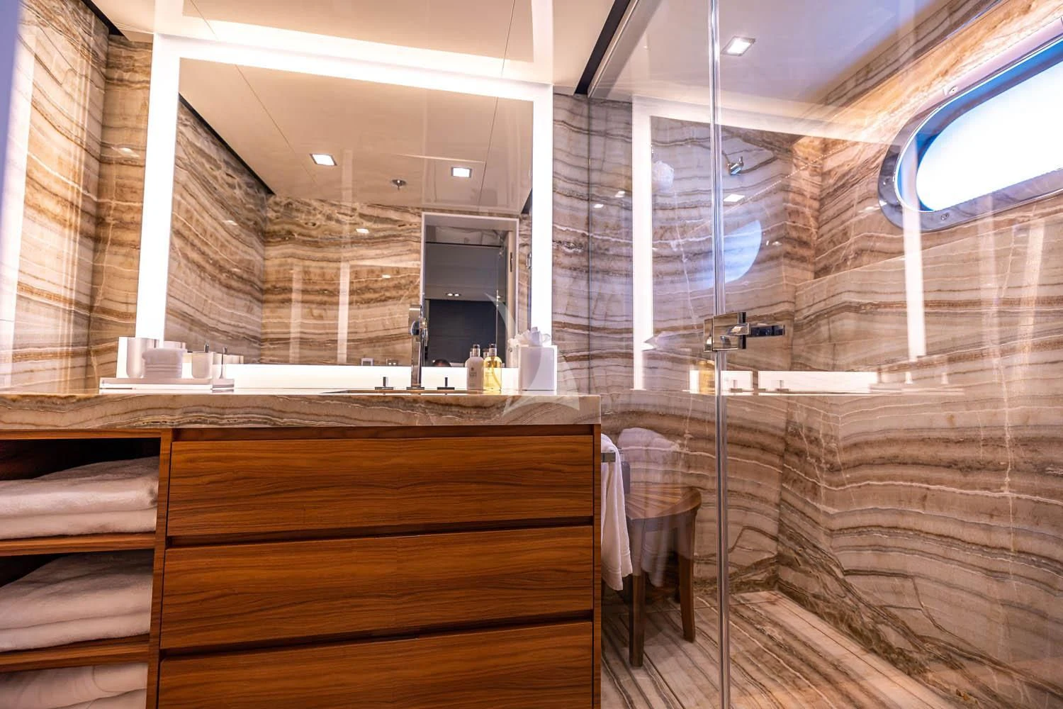a bathroom with a large mirror aboard CHASSEUR Yacht for Charter