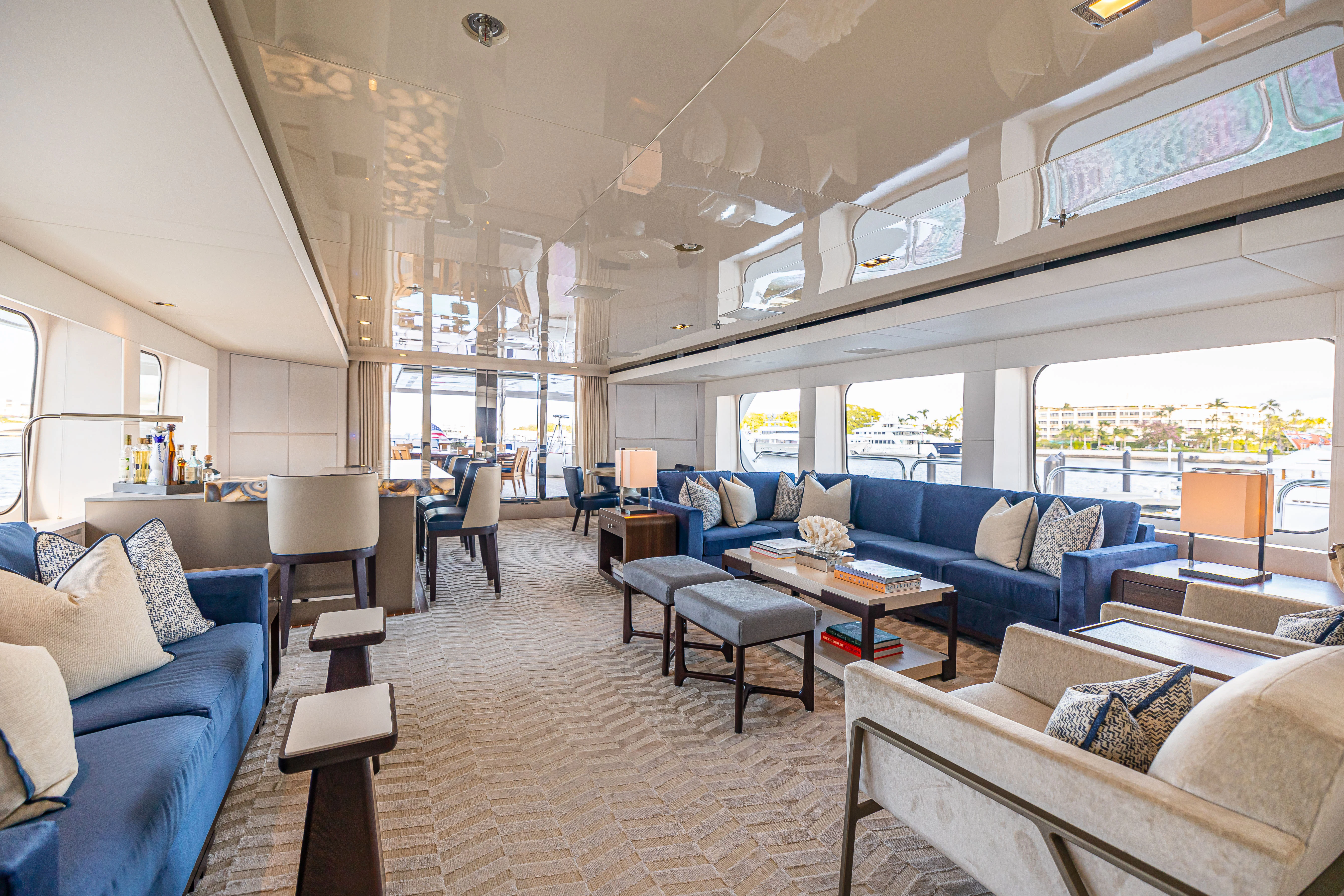 a living room with a large window aboard CHASSEUR Yacht for Charter
