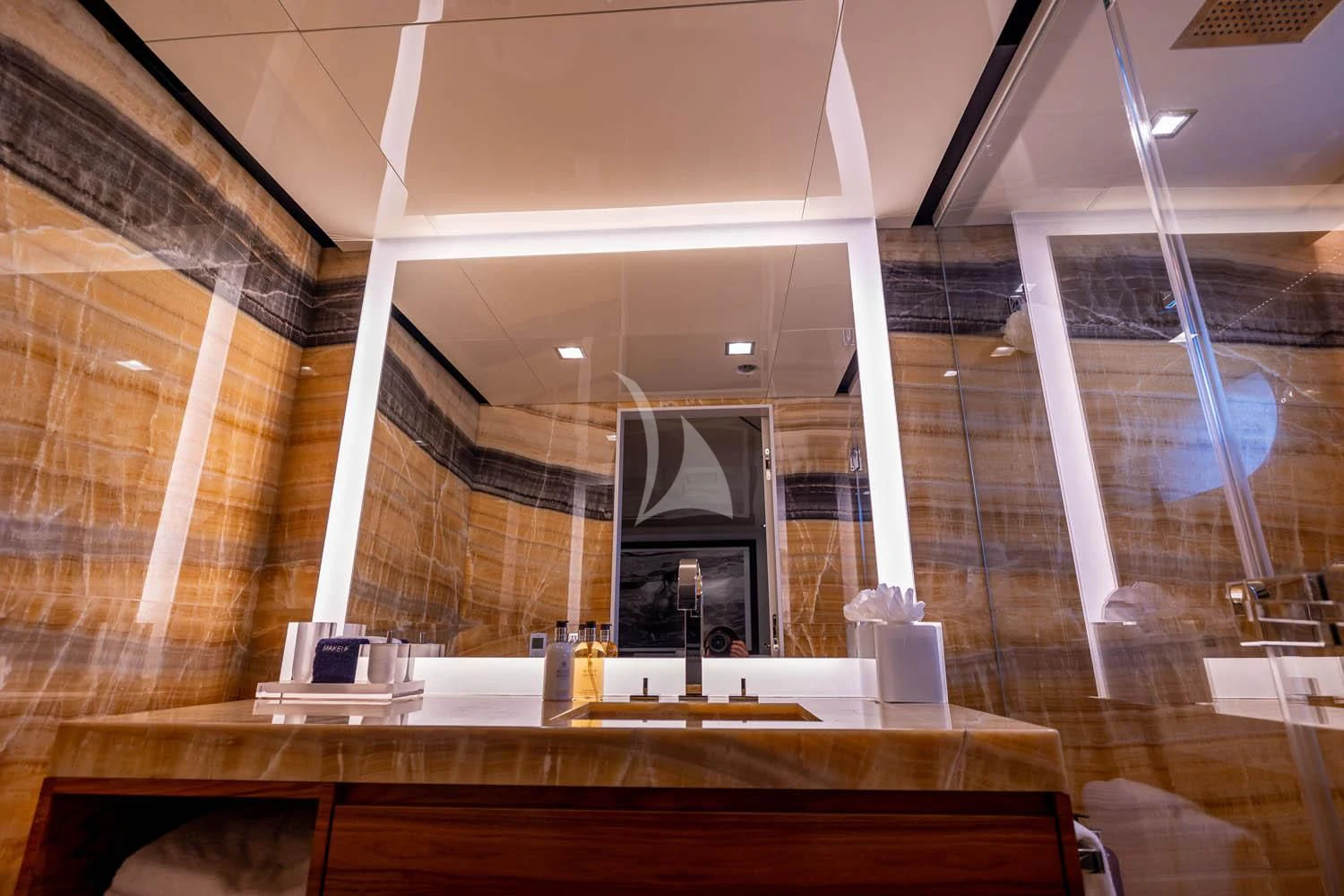 a room with a large mirror aboard CHASSEUR Yacht for Charter