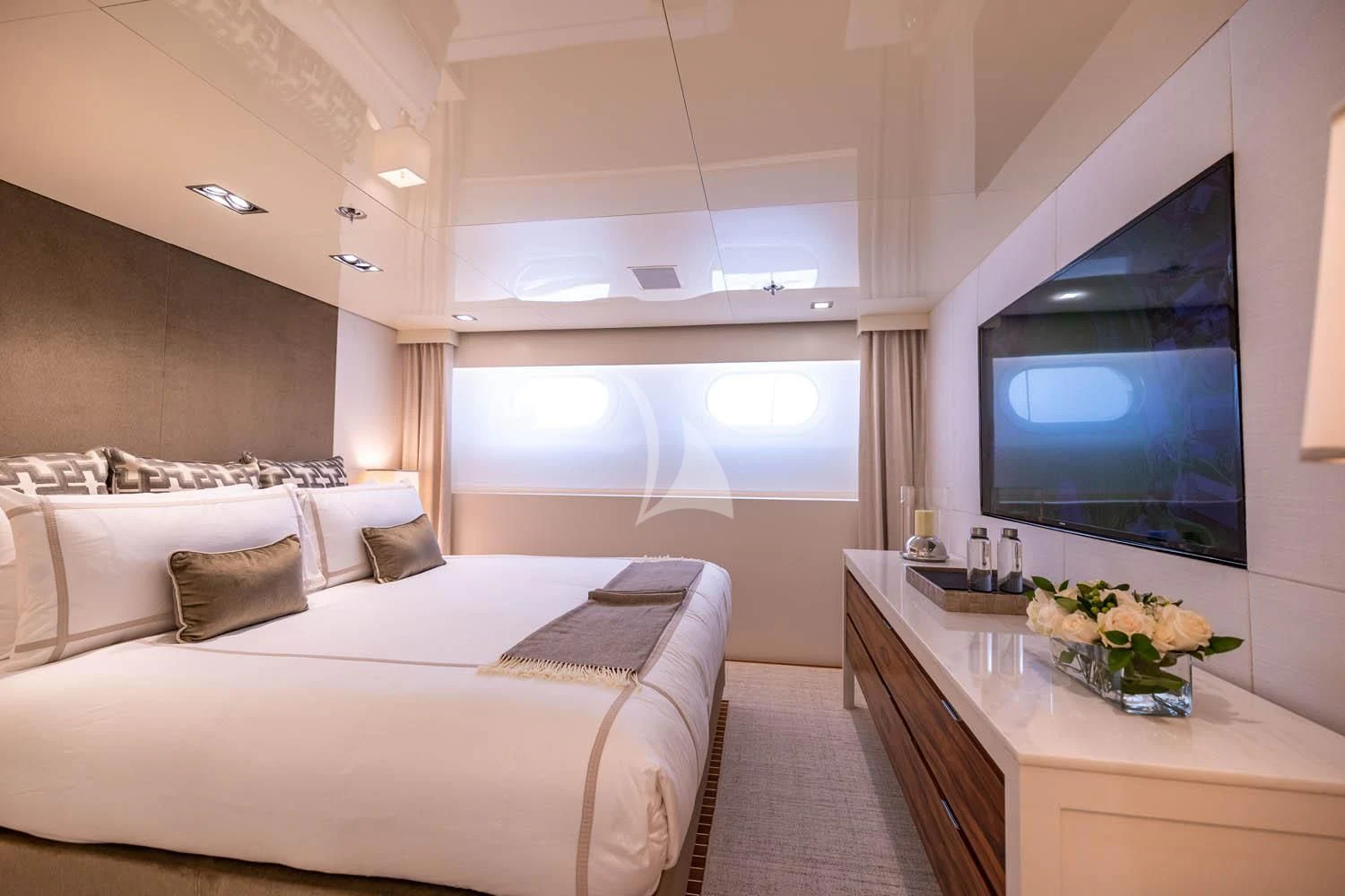 a bedroom with a large bed aboard CHASSEUR Yacht for Charter