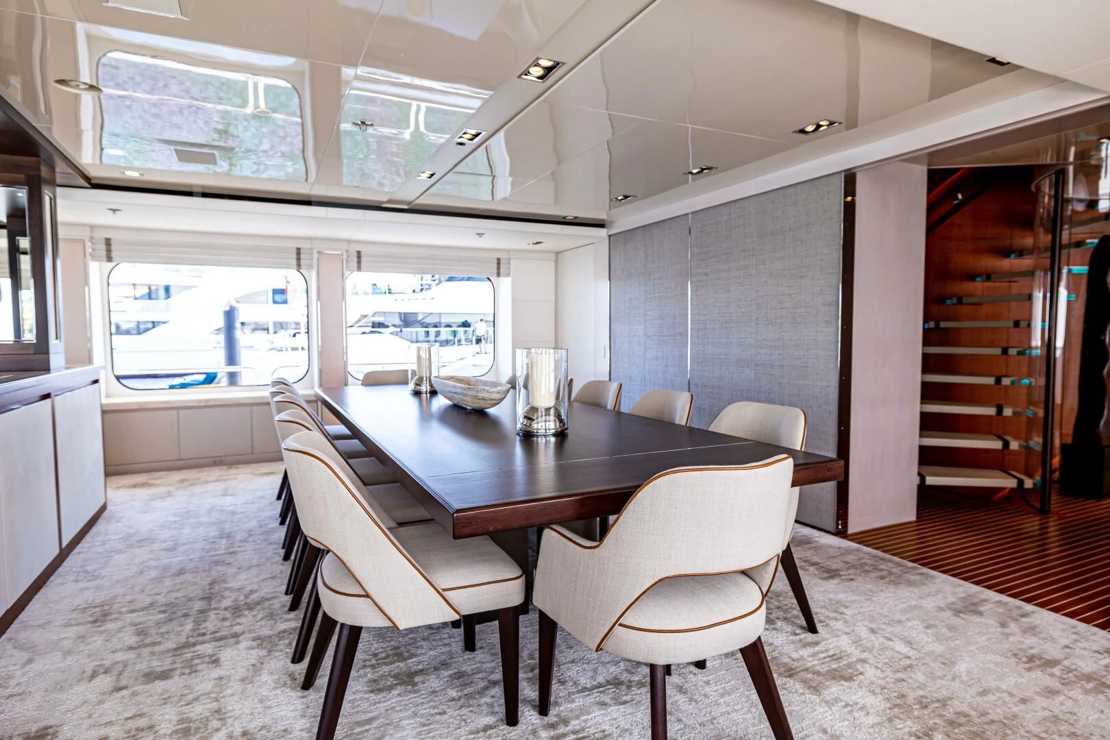 a large room with a table and chairs aboard CHASSEUR Yacht for Charter