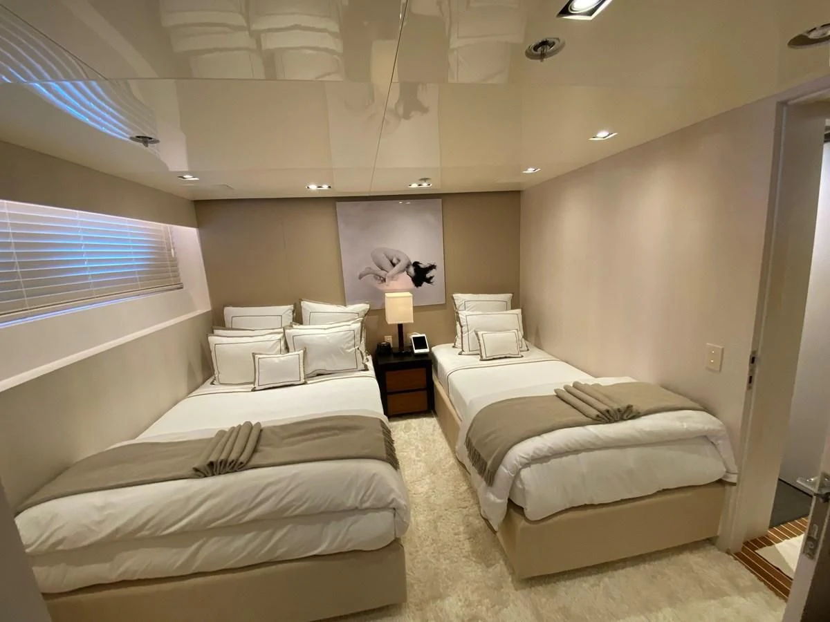 a room with two beds aboard CHASSEUR Yacht for Charter