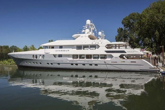 a white boat on water aboard CHASSEUR Yacht for Charter