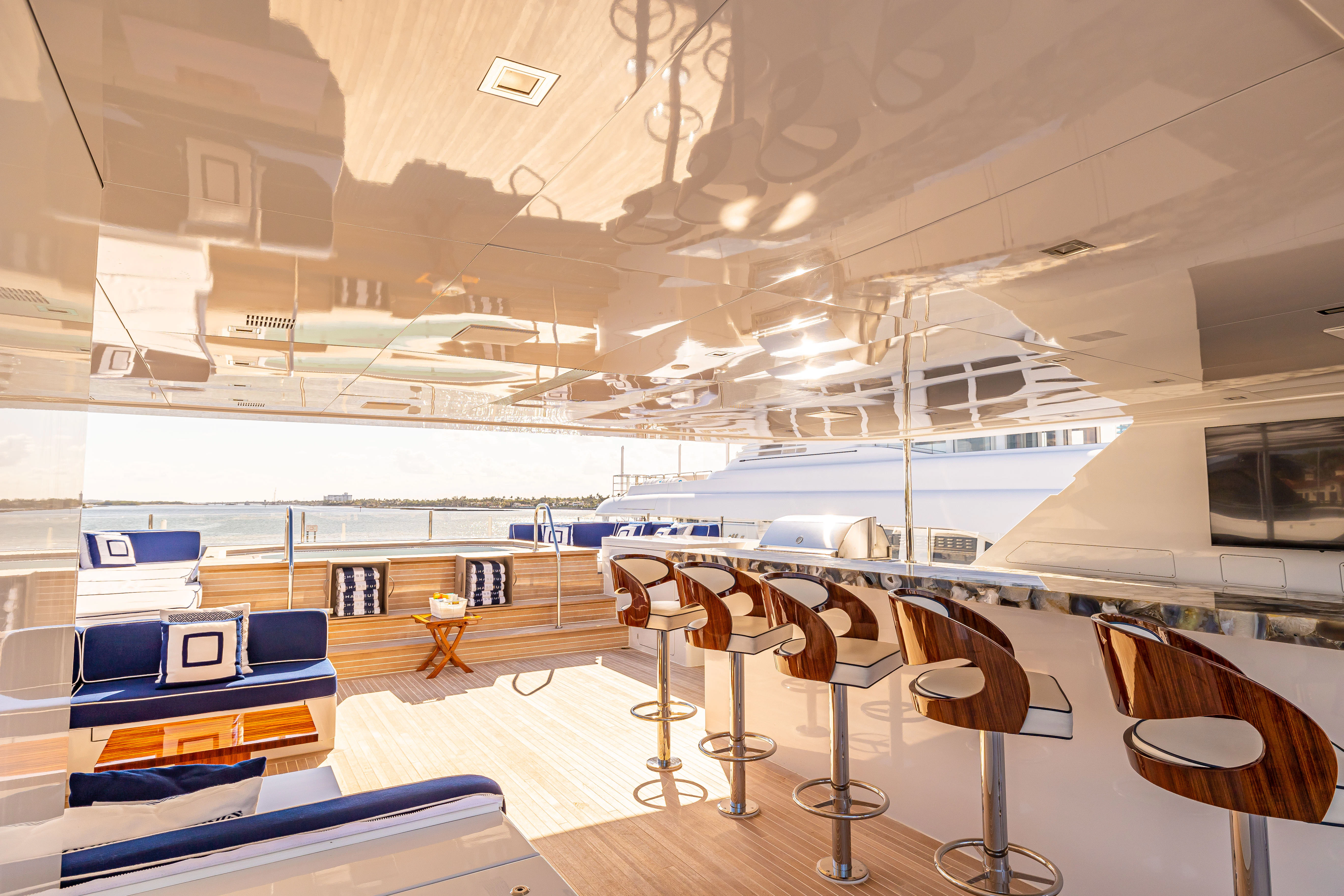 a room with tables and chairs aboard CHASSEUR Yacht for Charter