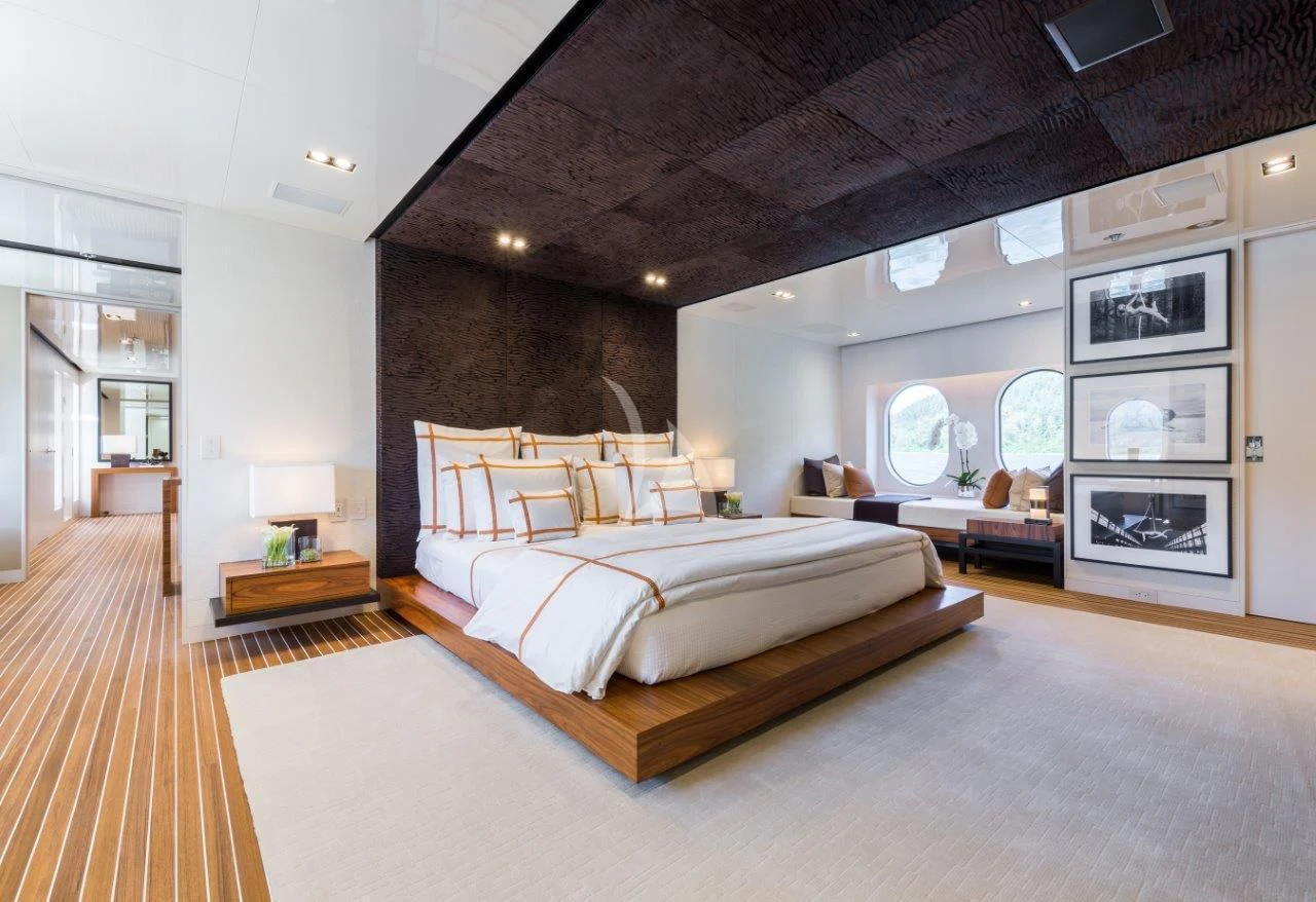 a large bedroom with a large bed aboard CHASSEUR Yacht for Charter
