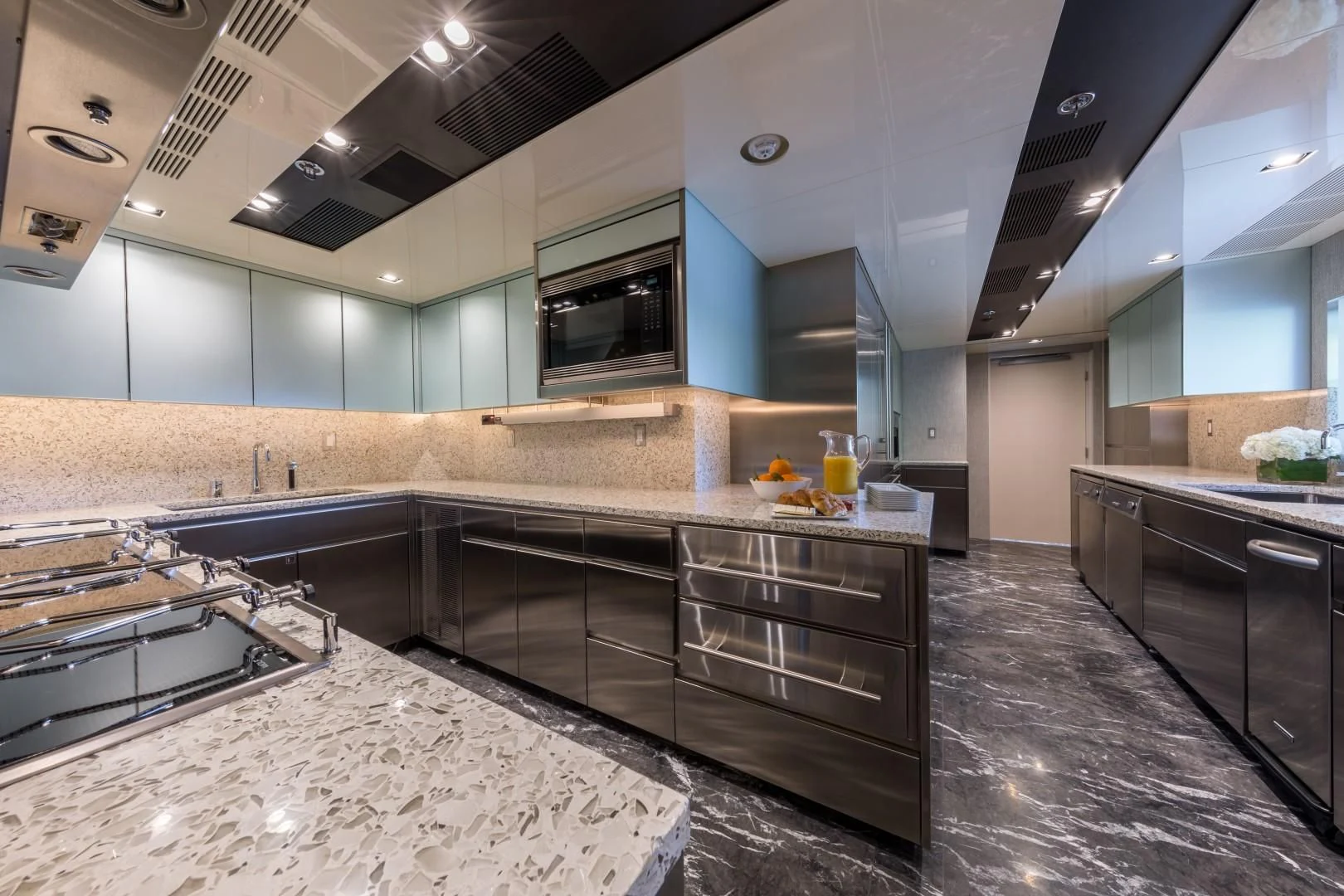 a kitchen with a large island aboard CHASSEUR Yacht for Charter