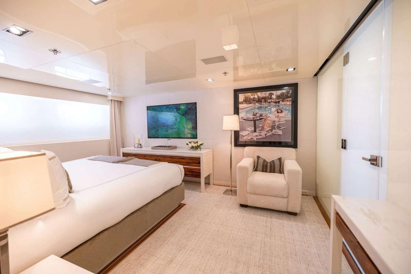 a living room with a large screen aboard CHASSEUR Yacht for Charter