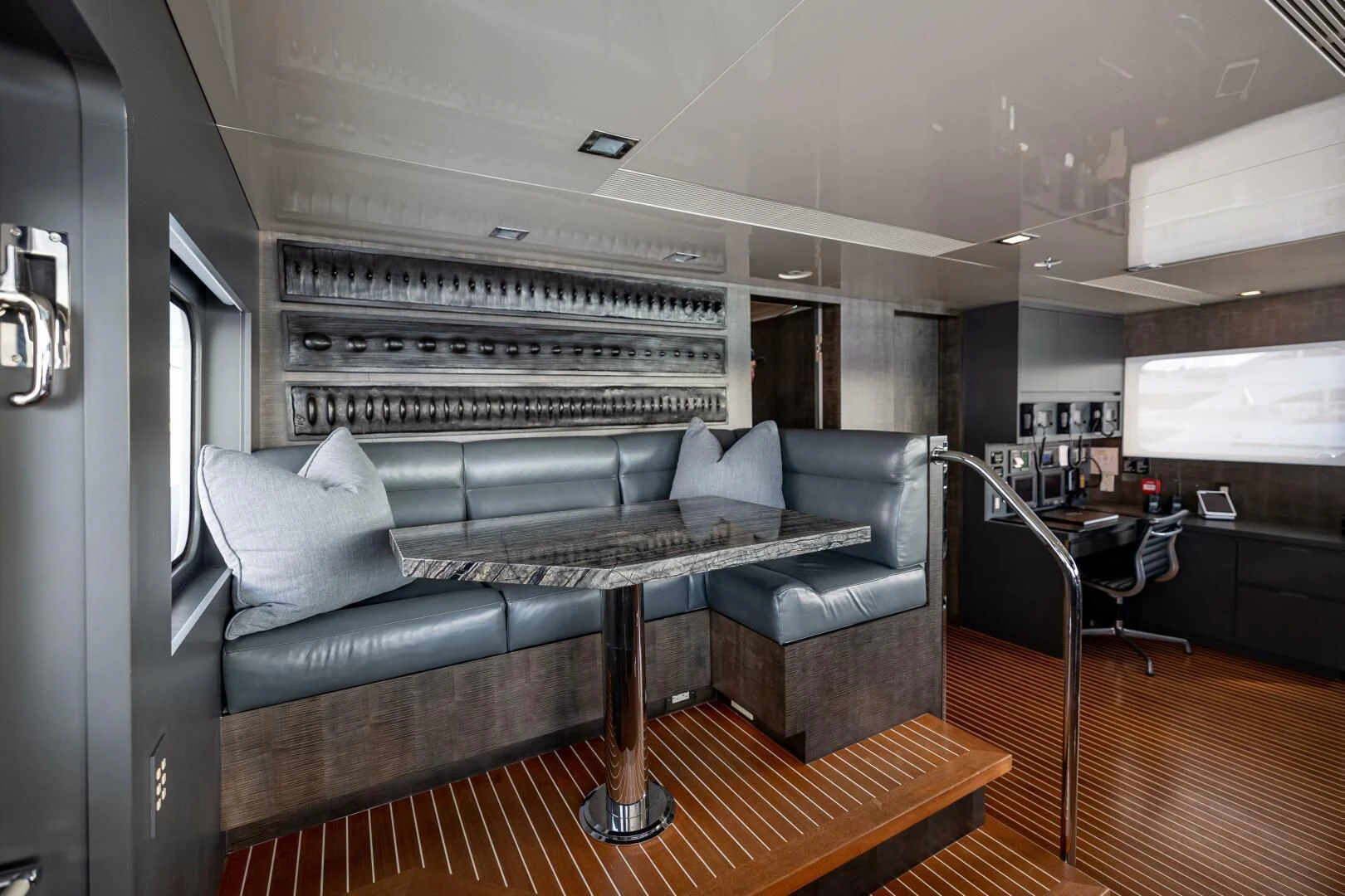 a living room with a couch and a table aboard CHASSEUR Yacht for Charter