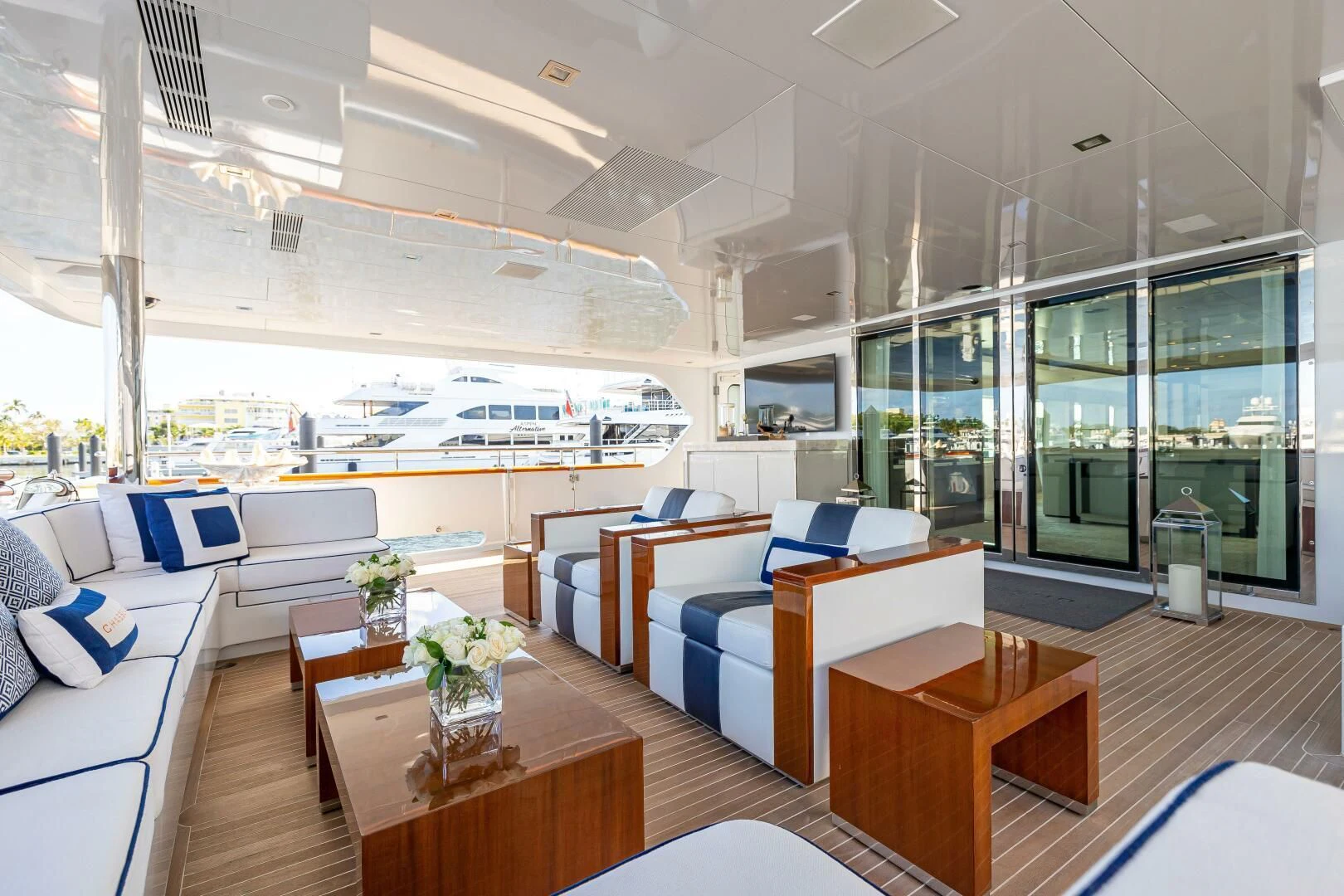 a room with a table and chairs aboard CHASSEUR Yacht for Charter