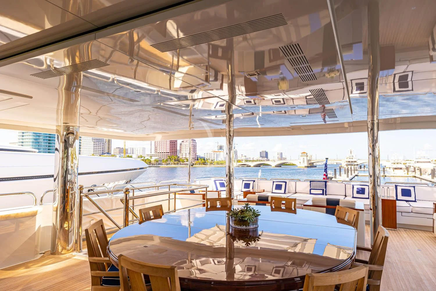 a room with a table and chairs aboard CHASSEUR Yacht for Charter