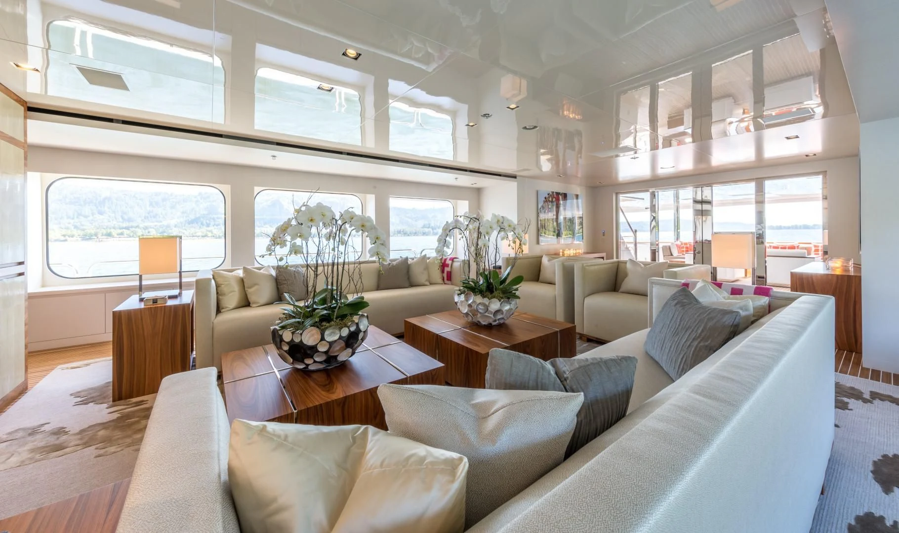 a living room with a couch and a table aboard CHASSEUR Yacht for Charter