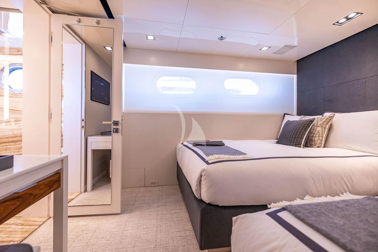 a room with a bed and a window aboard CHASSEUR Yacht for Charter