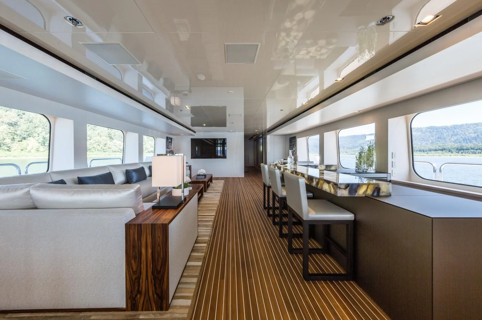 a room with a couch and a table aboard CHASSEUR Yacht for Charter