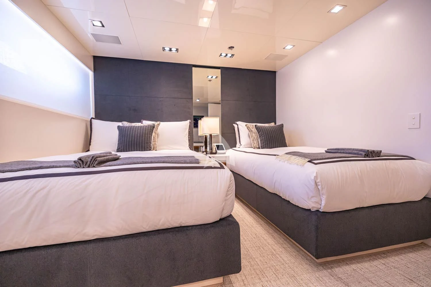 a room with two beds aboard CHASSEUR Yacht for Charter