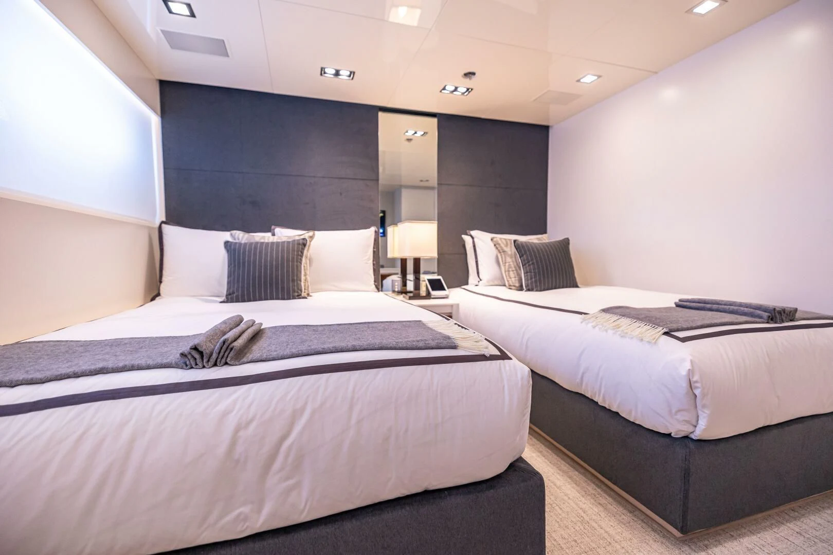 a room with three beds aboard CHASSEUR Yacht for Charter