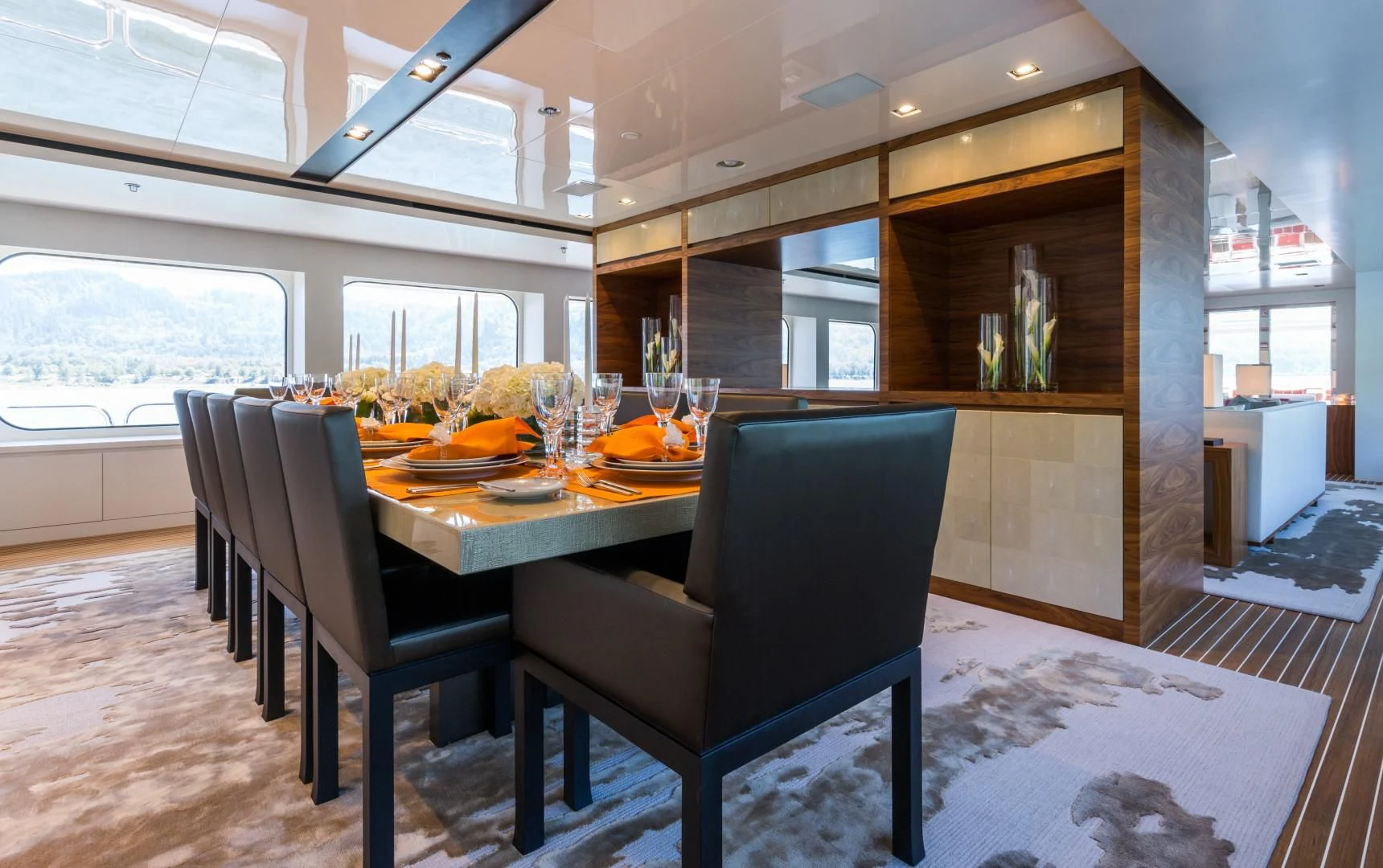 a dining room with a table and chairs aboard CHASSEUR Yacht for Charter