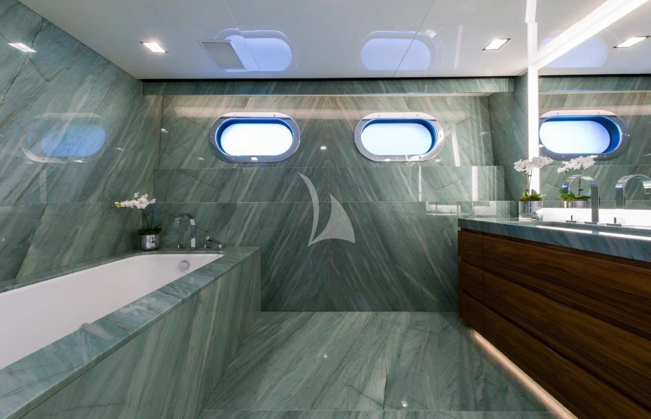 a bathroom with a large jacuzzi tub aboard CHASSEUR Yacht for Charter