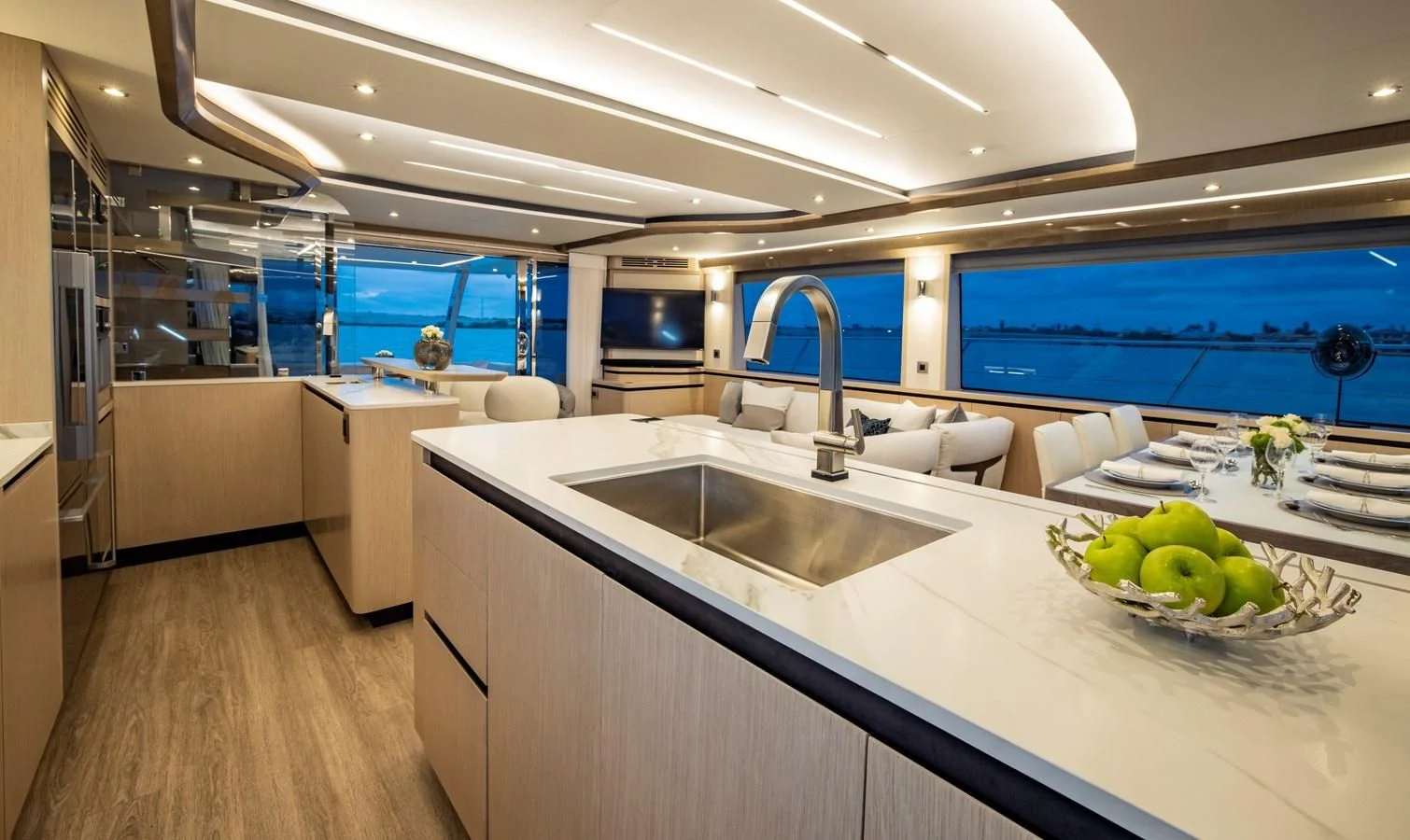 a kitchen with a large island aboard PLANE TO SEA Yacht for Sale