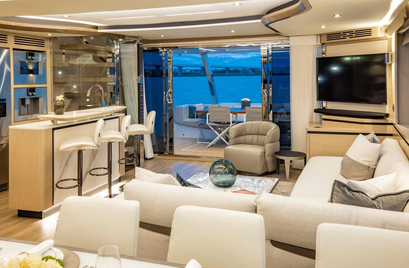 a living room with a large window aboard PLANE TO SEA Yacht for Sale