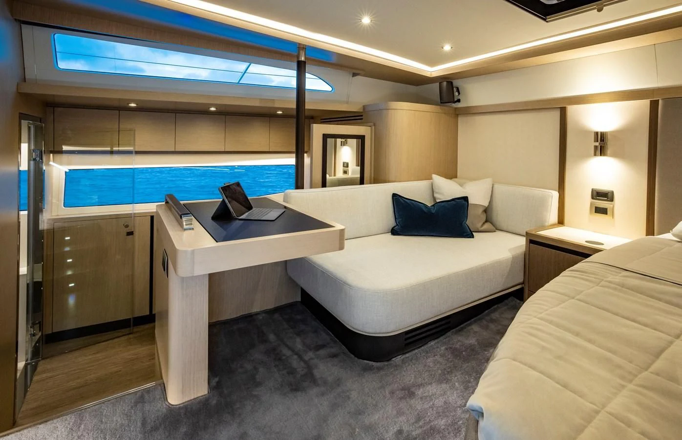 a room with a bed and a desk aboard PLANE TO SEA Yacht for Sale