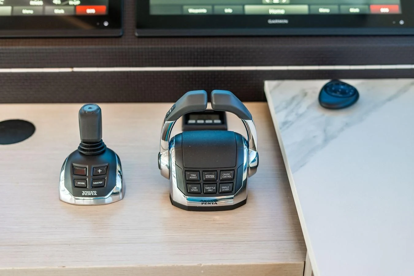 a couple of electronic devices on a table aboard PLANE TO SEA Yacht for Sale
