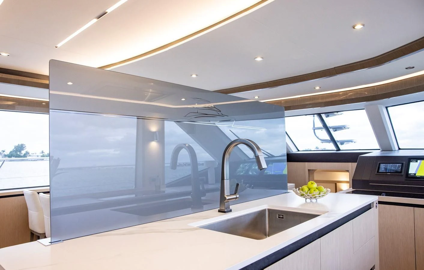 a kitchen with a sink and microwave aboard PLANE TO SEA Yacht for Sale