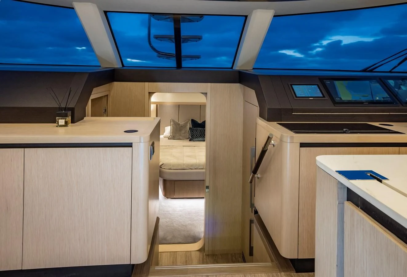 a room with a bed and a desk aboard PLANE TO SEA Yacht for Sale