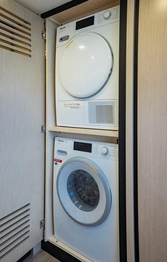 a washing machine in a room aboard PLANE TO SEA Yacht for Sale