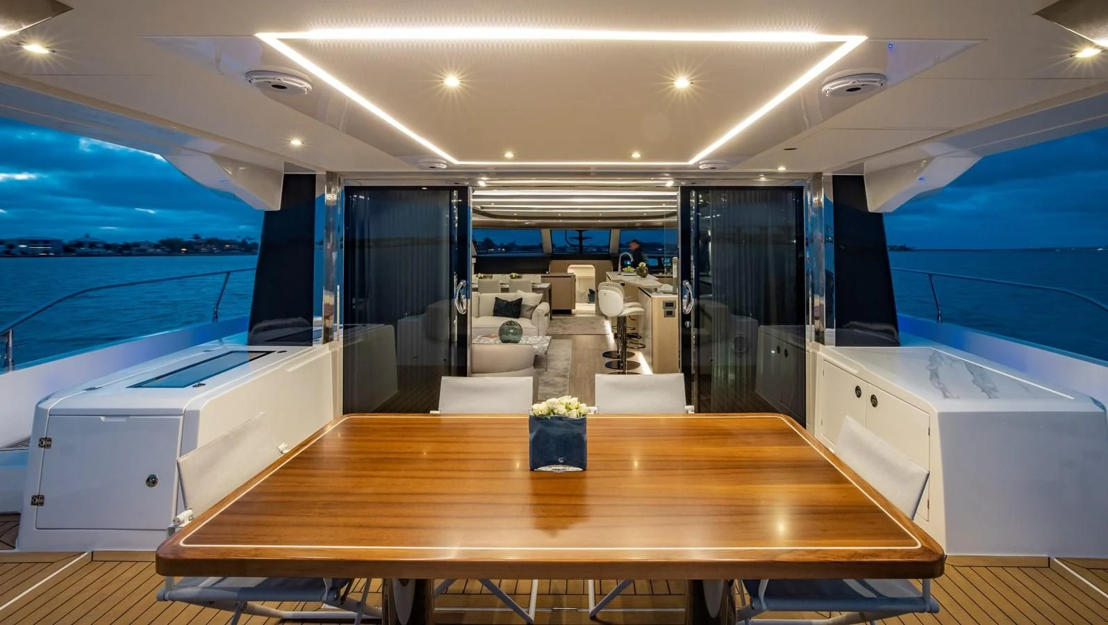 a room with a table and chairs aboard PLANE TO SEA Yacht for Sale