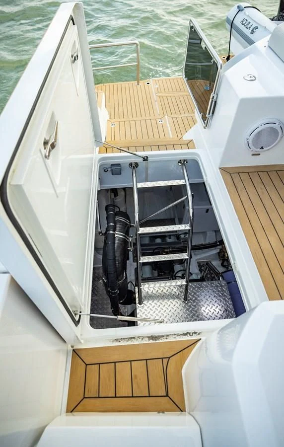 a boat with a black object on the front aboard PLANE TO SEA Yacht for Sale