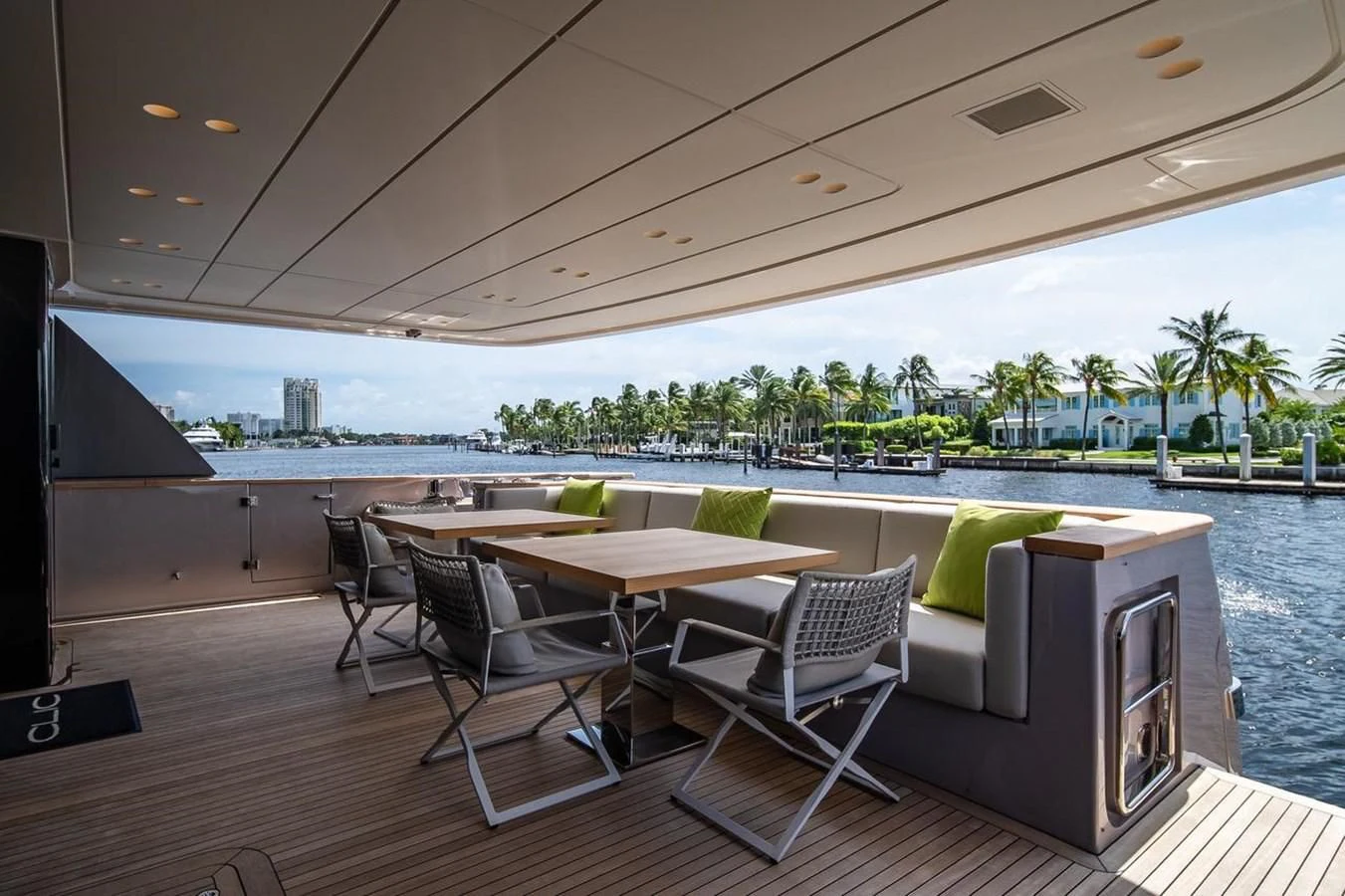 a table and chairs on a deck aboard JICJ Yacht for Sale