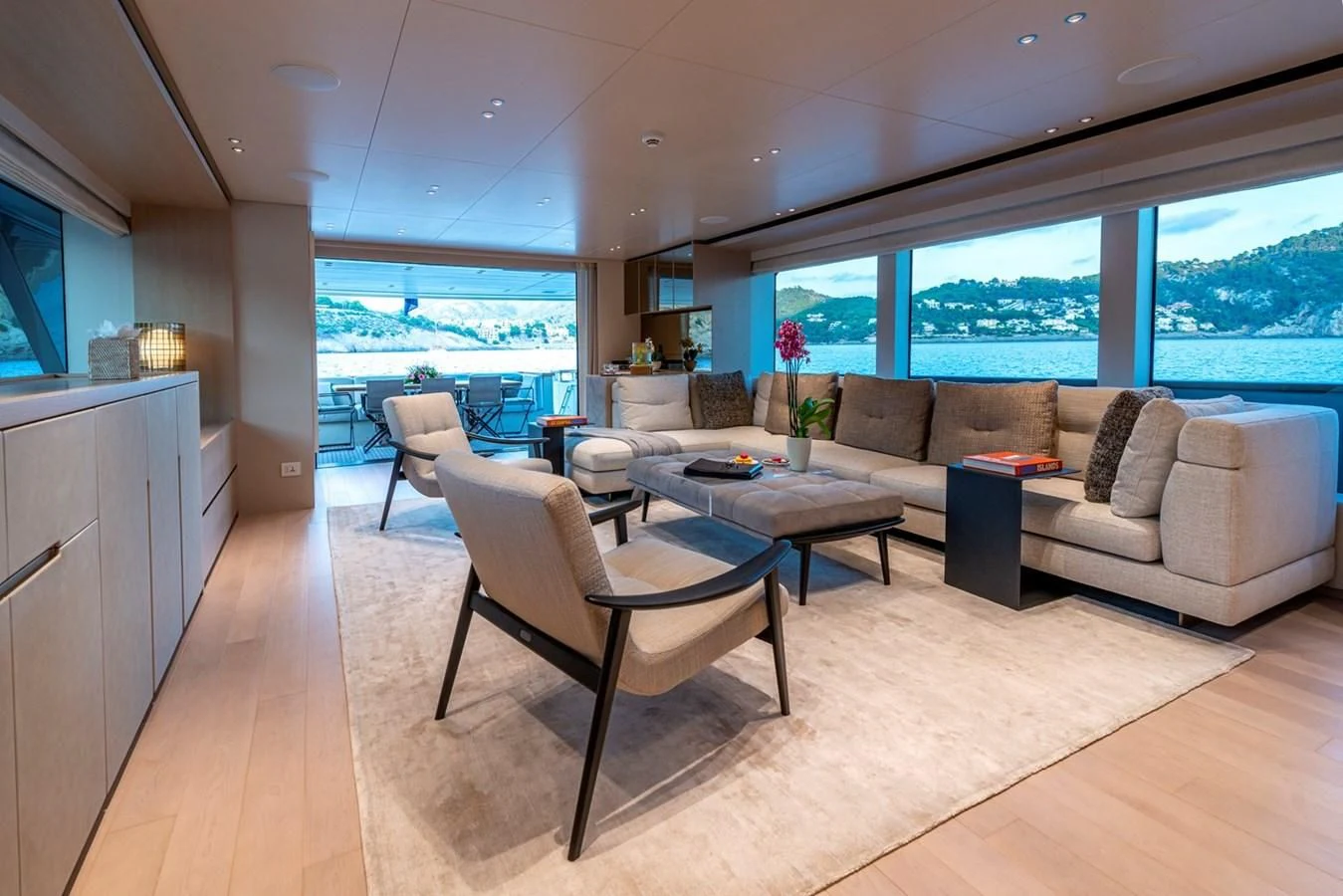 a living room with a couch and a table aboard JICJ Yacht for Sale