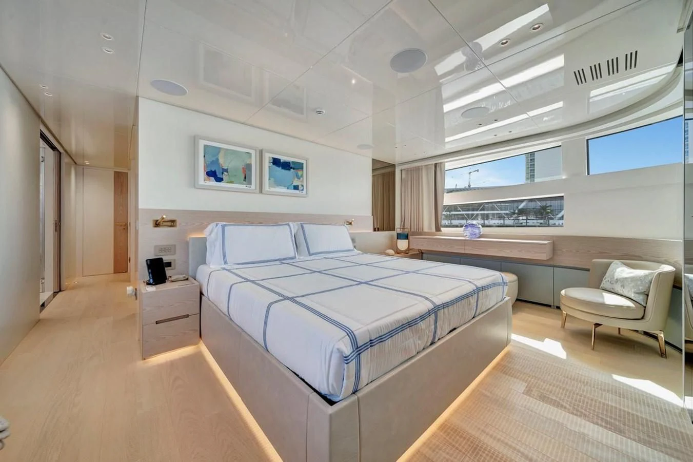 a room with a bed and a chair aboard JICJ Yacht for Sale
