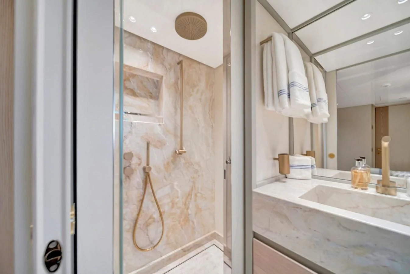 a bathroom with a sink and a mirror aboard JICJ Yacht for Sale