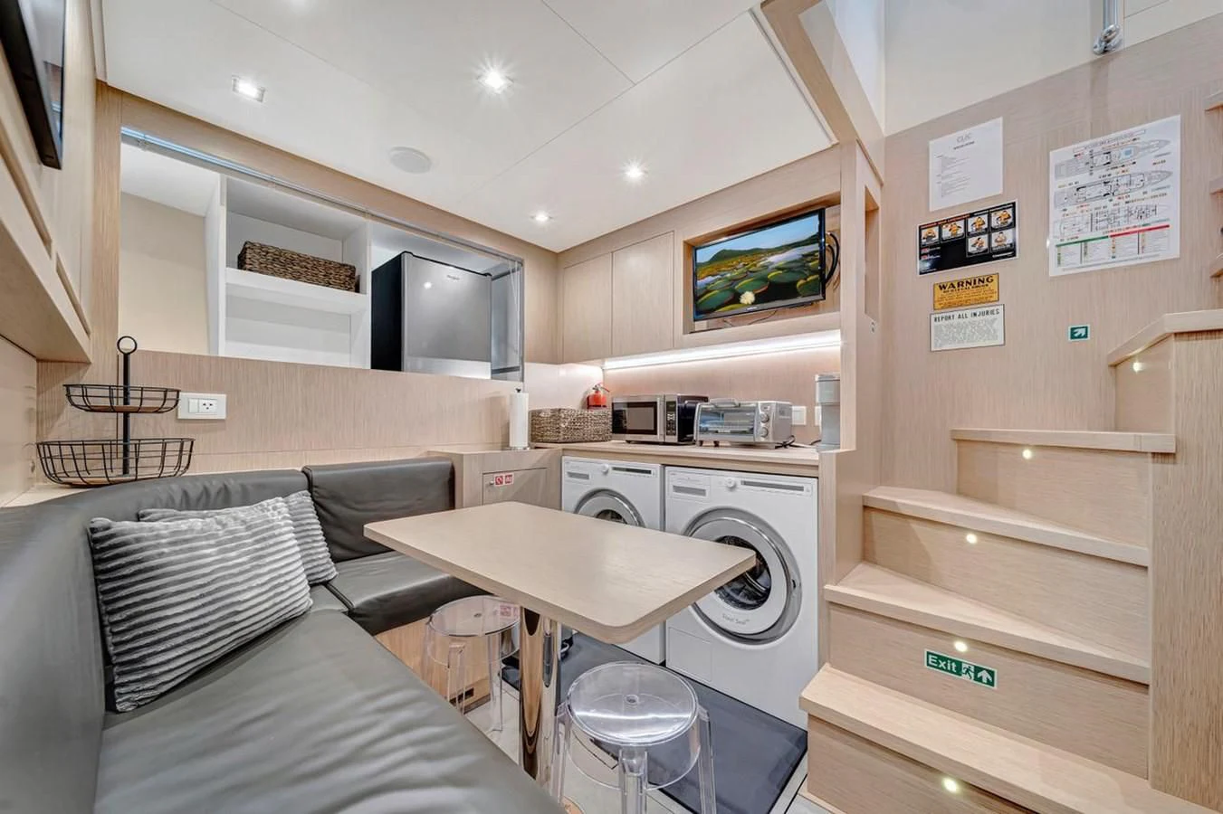 a room with a couch and a table aboard JICJ Yacht for Sale