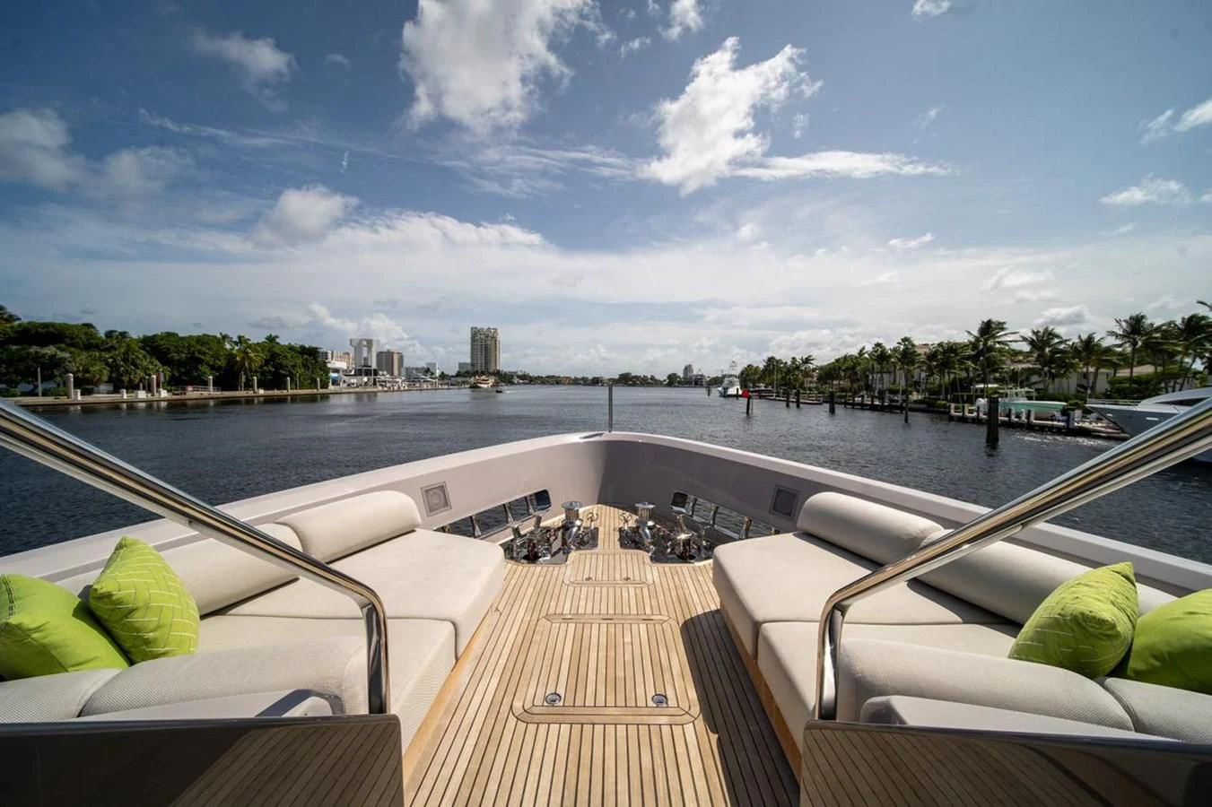 a deck with a view of a city and water aboard JICJ Yacht for Sale