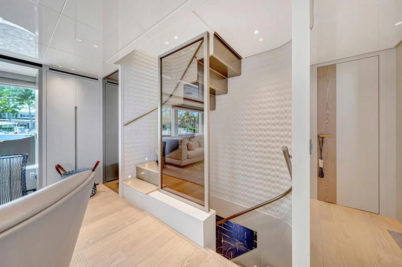 a room with a staircase and a window aboard JICJ Yacht for Sale