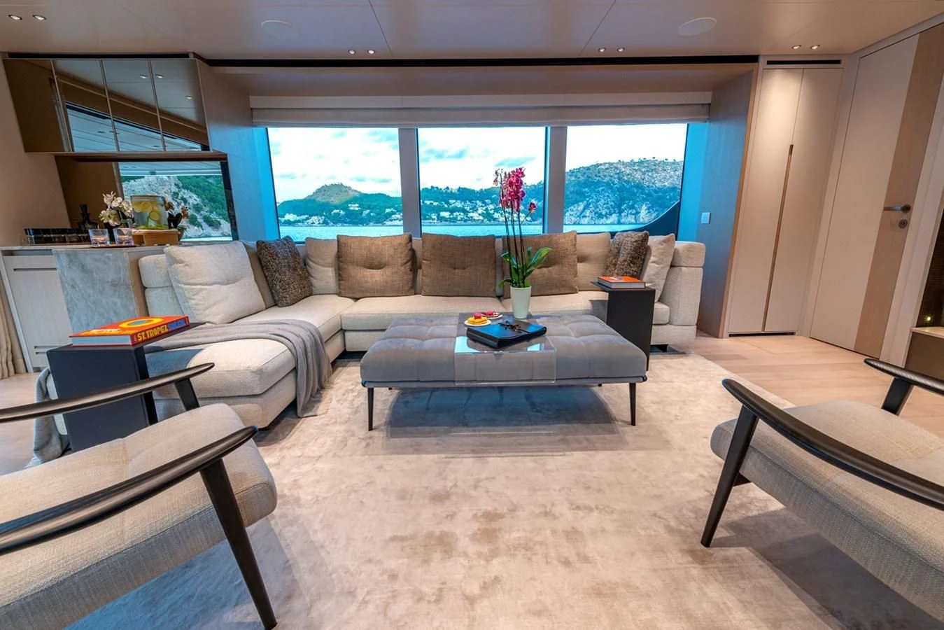 a living room with a couch and a coffee table aboard JICJ Yacht for Sale