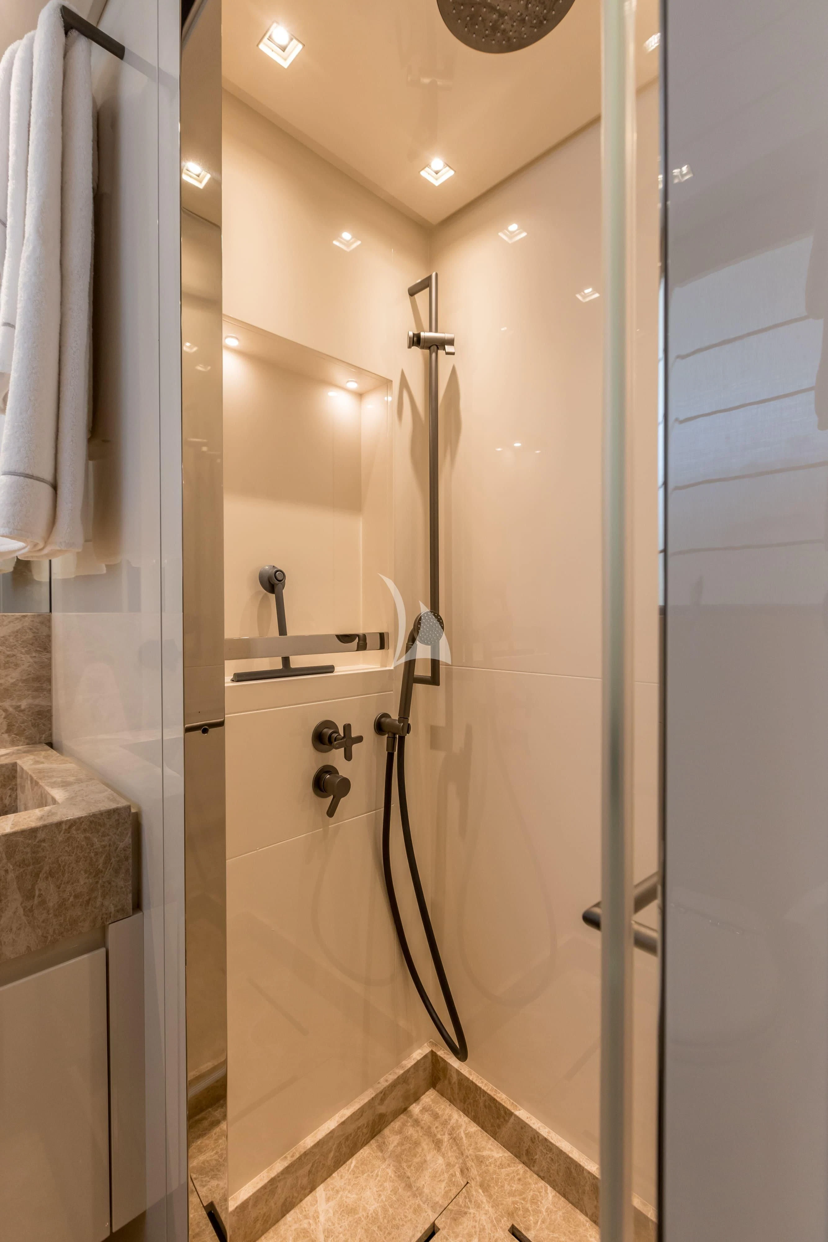 a bathroom with a shower unit aboard JICJ Yacht for Sale