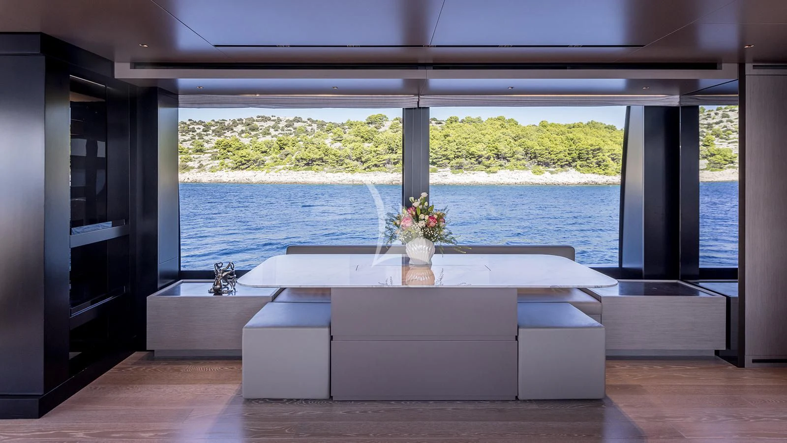 a room with a large window and a view of the water aboard JICJ Yacht for Sale