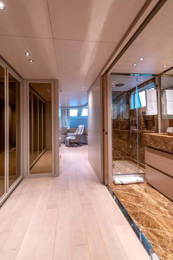 a room with a wood floor and a glass door aboard JICJ Yacht for Sale