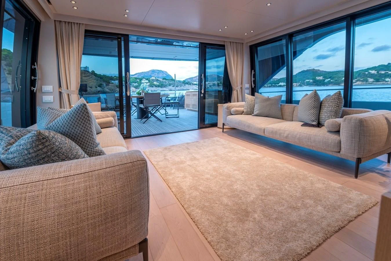 a living room with a large window aboard JICJ Yacht for Sale