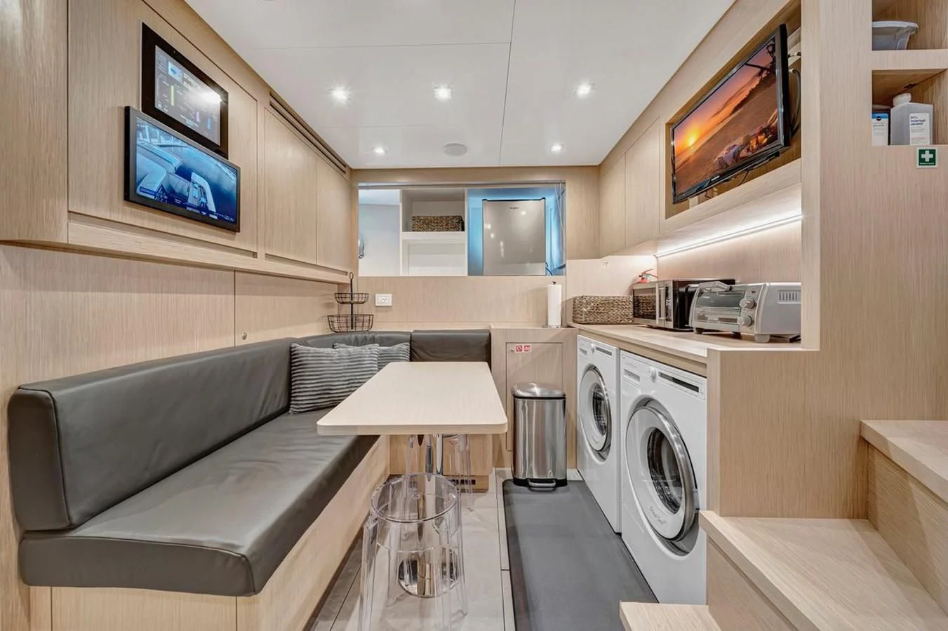 a room with a couch and a television aboard JICJ Yacht for Sale