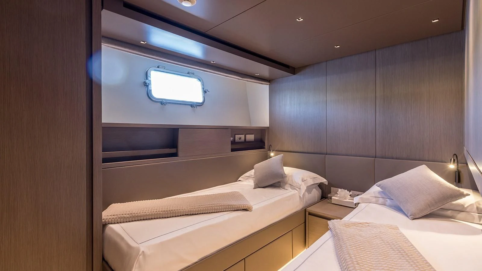 a room with a bed and a television aboard JICJ Yacht for Sale